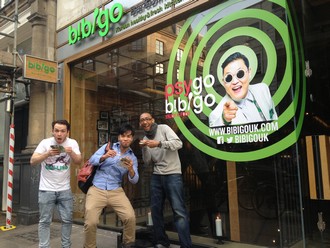 people eating Bibigo promotional food